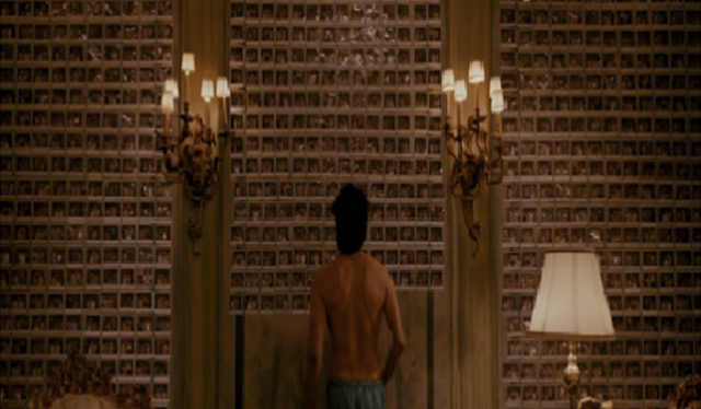 Figure2 : The wall is full of the photos of the women and men Aladeen had sexual intercourse with